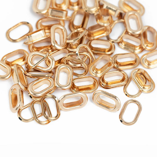 WE R OVAL EYELETS GOLD 50 PZ - OJALES OVALADOS ORO